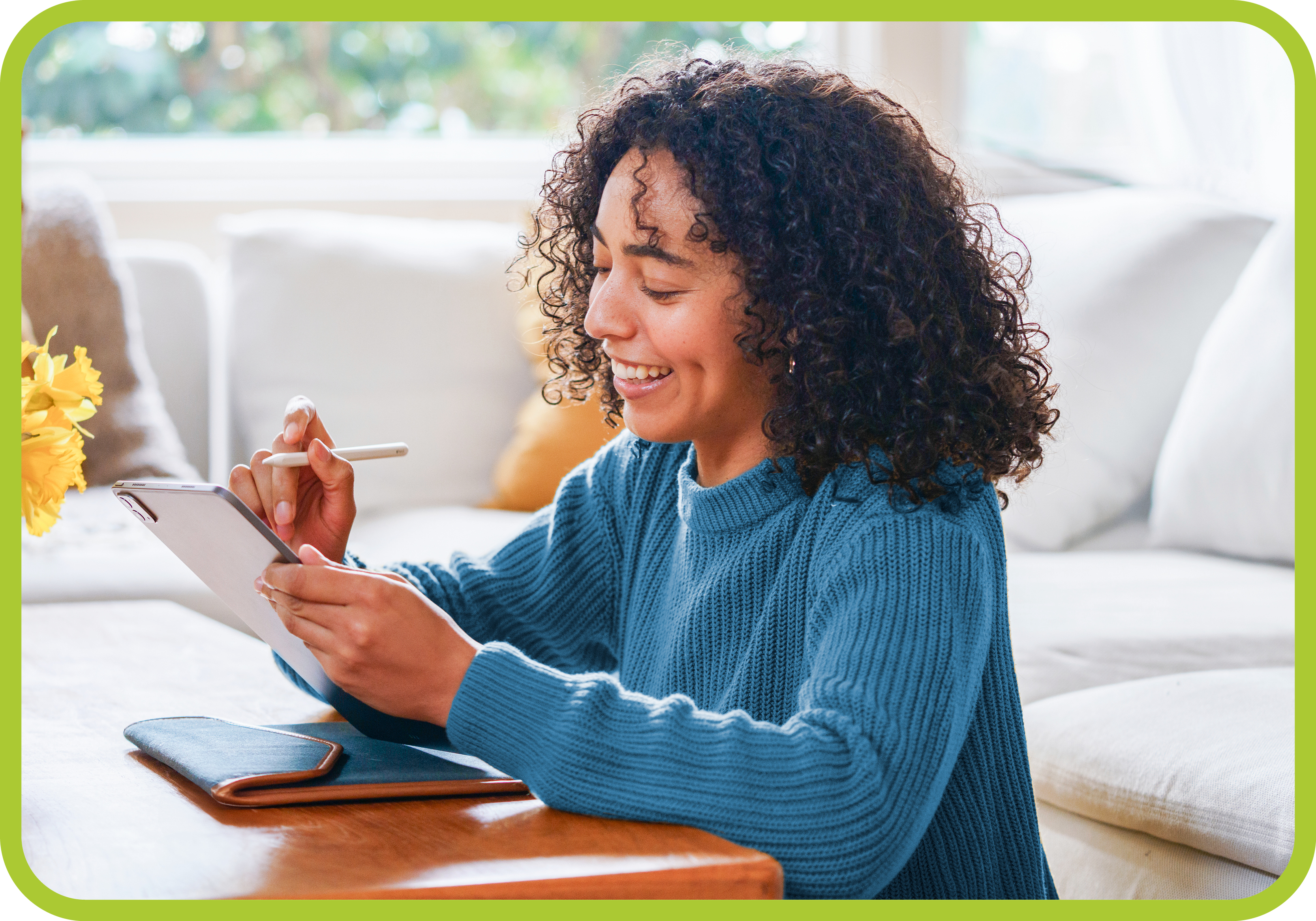 young girl writing on iPad